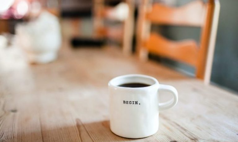 white ceramic mug on table